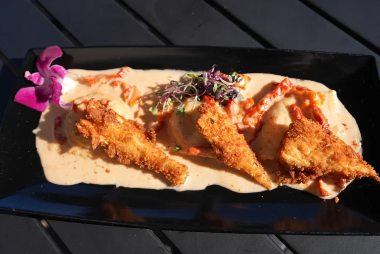 Crispy chef's special in cream sauce with orchid garnish