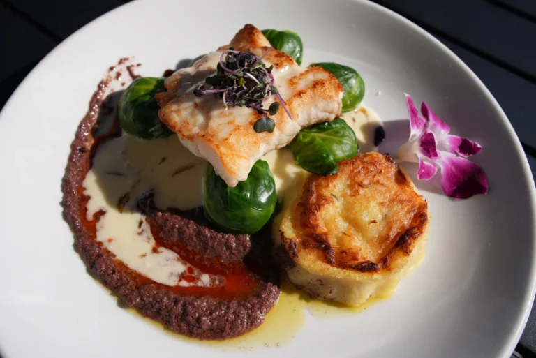 Pan-seared fish with Brussels sprouts and golden potato at Mezza Luna Bistro